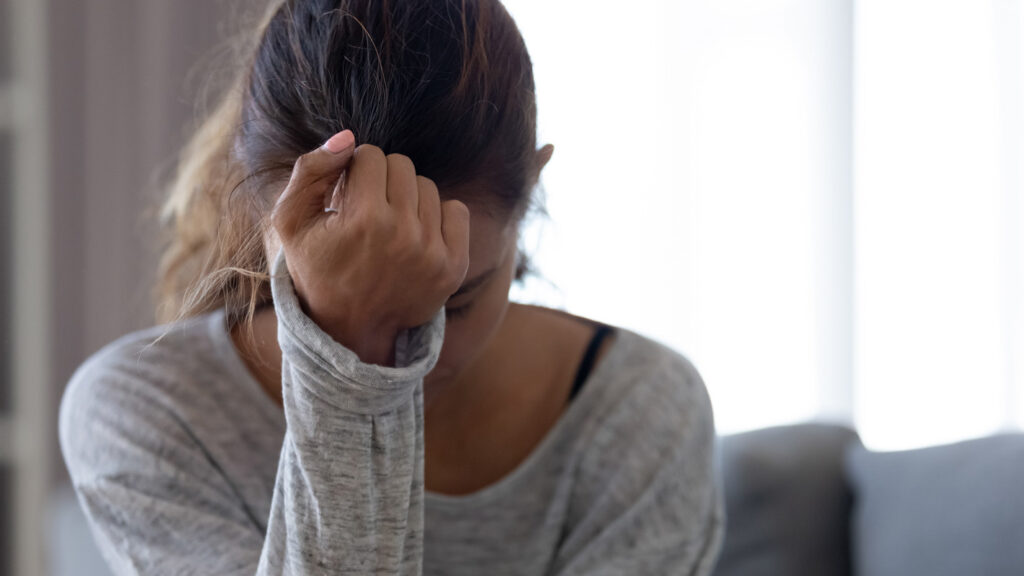 Woman struggling with alcohol addiction