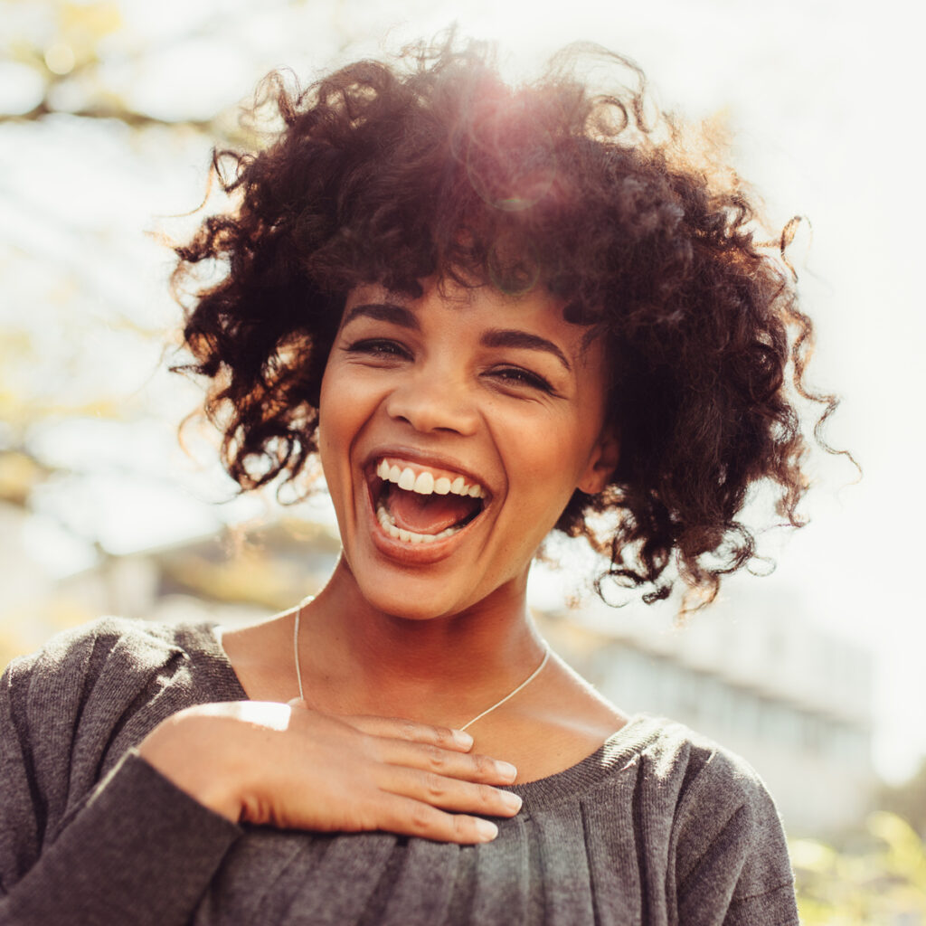 Happy woman smiling outdoors